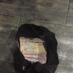 Чиновники «засівали» вулиці пачками доларів (+фото)