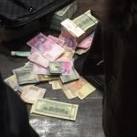 Чиновники «засівали» вулиці пачками доларів (+фото)